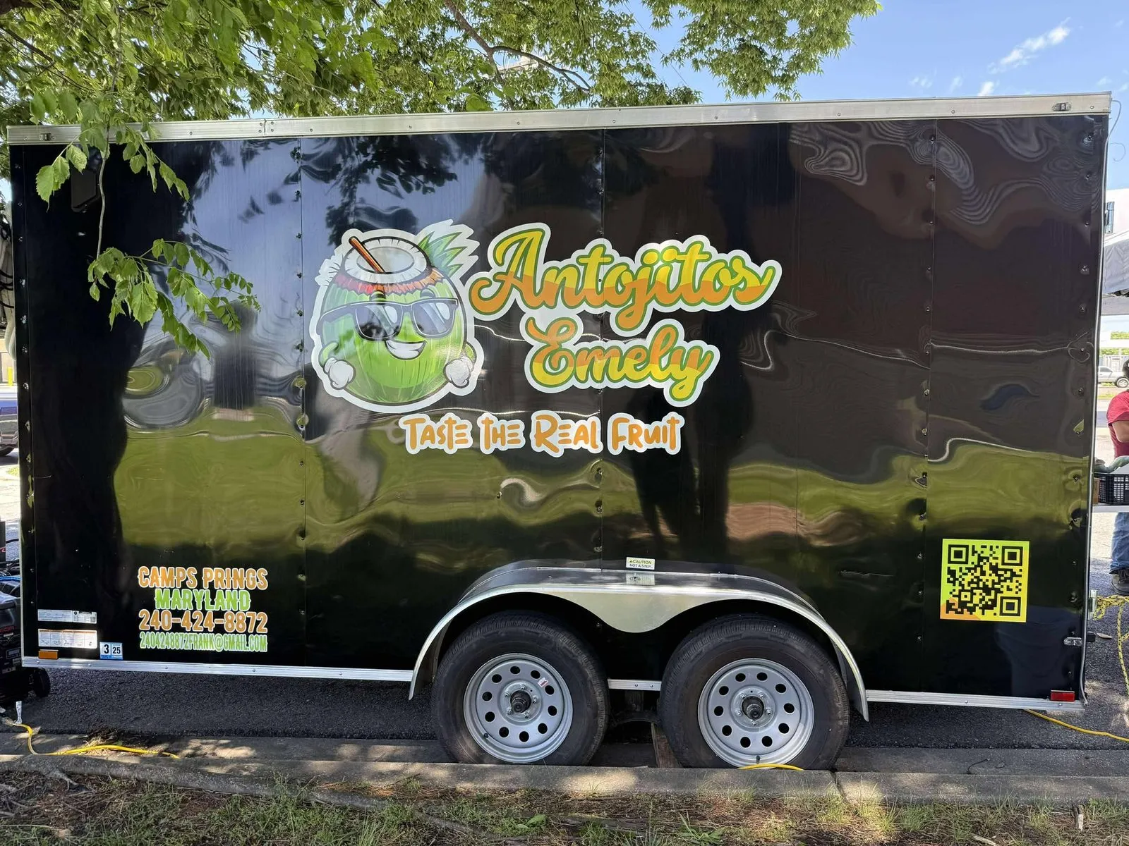 Antojitos Emely food trailer, rear view, black wrap with logo