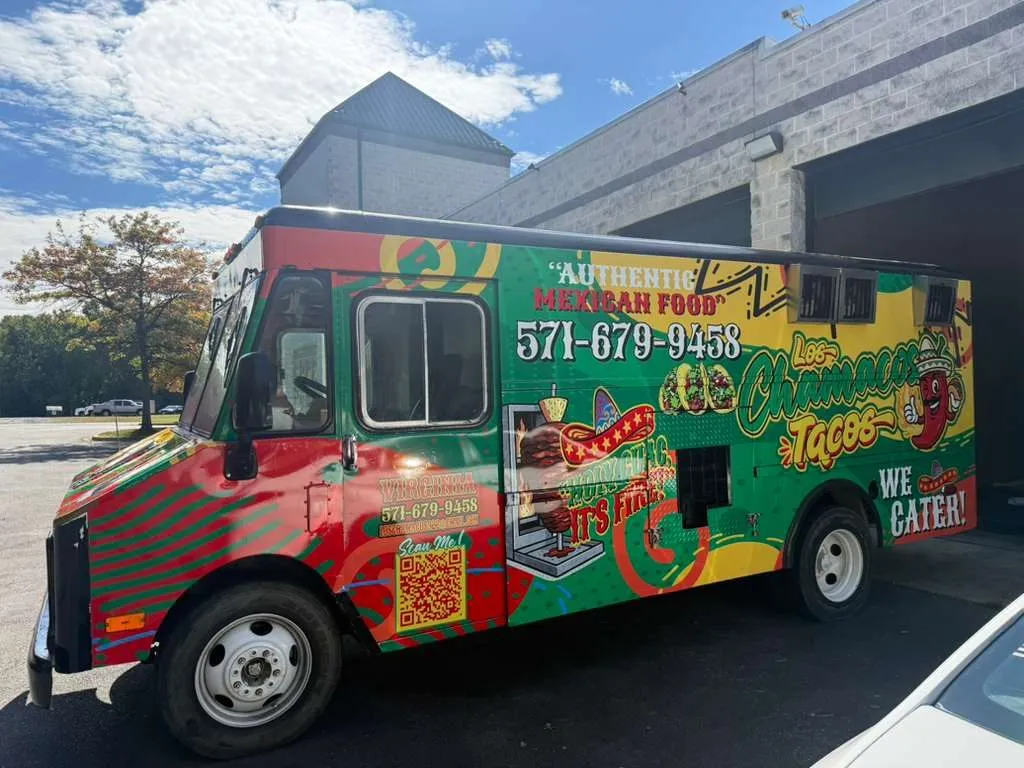 Los Chamacos Tacos food truck, side view, red and yellow wrap