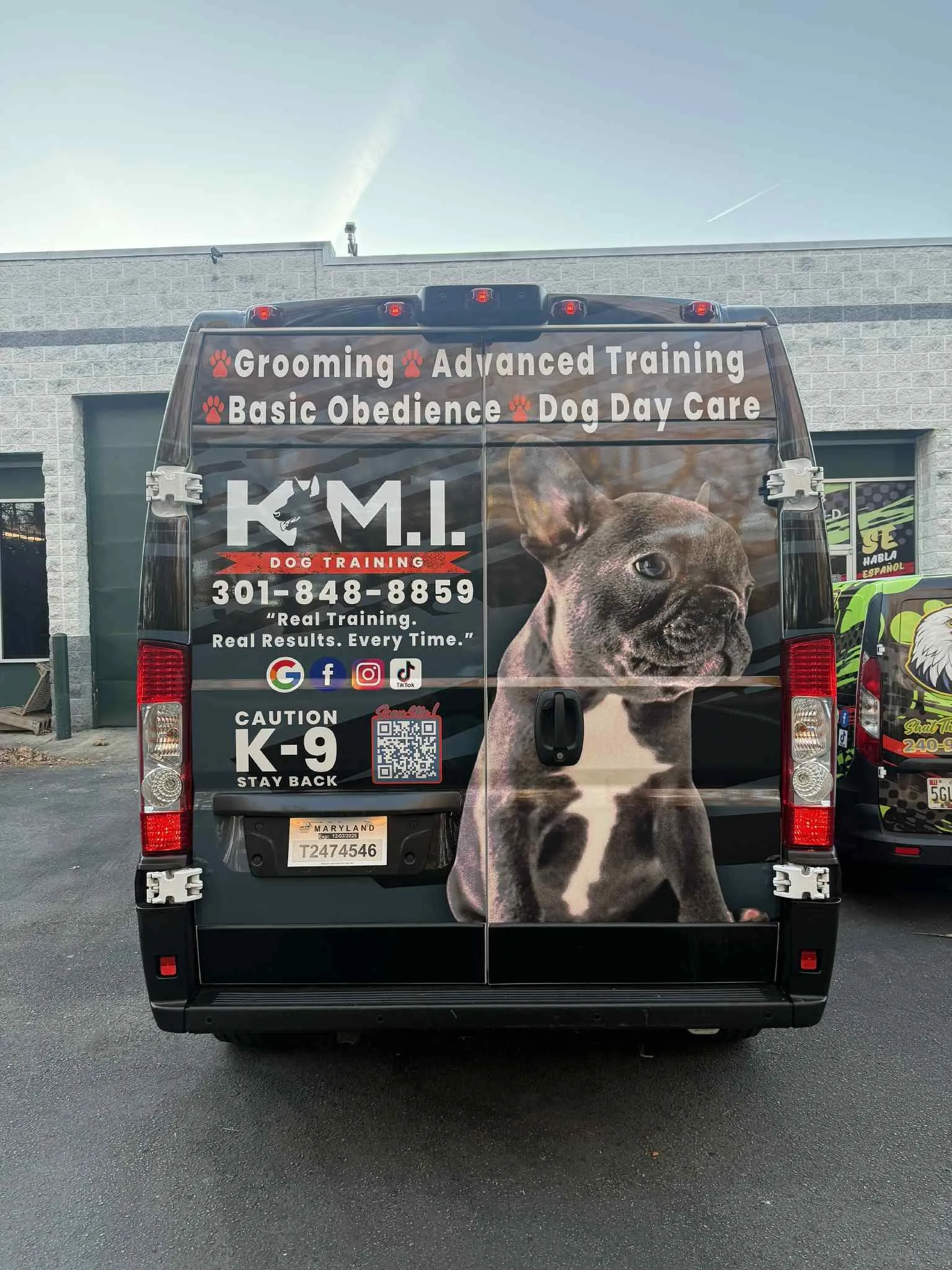 K.M.I Dog Training van, rear view, bulldog photo and Caution K-9 graphic