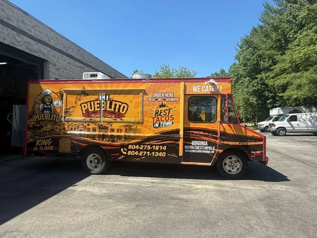 Mi Pueblito food truck, side view, orange wrap