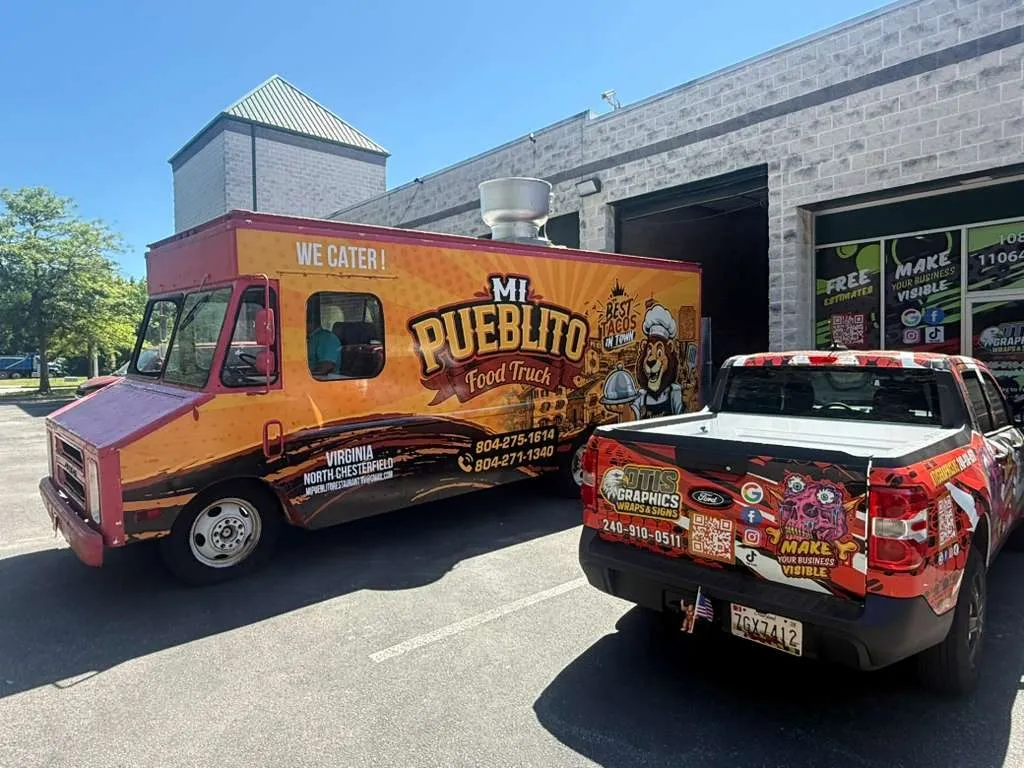 Mi Pueblito food truck parked with an Otis Graphics-wrapped pickup
