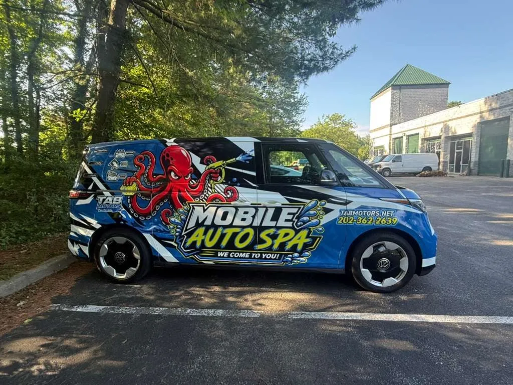 Mobile Auto Spa van with octopus mascot wrap in a parking lot