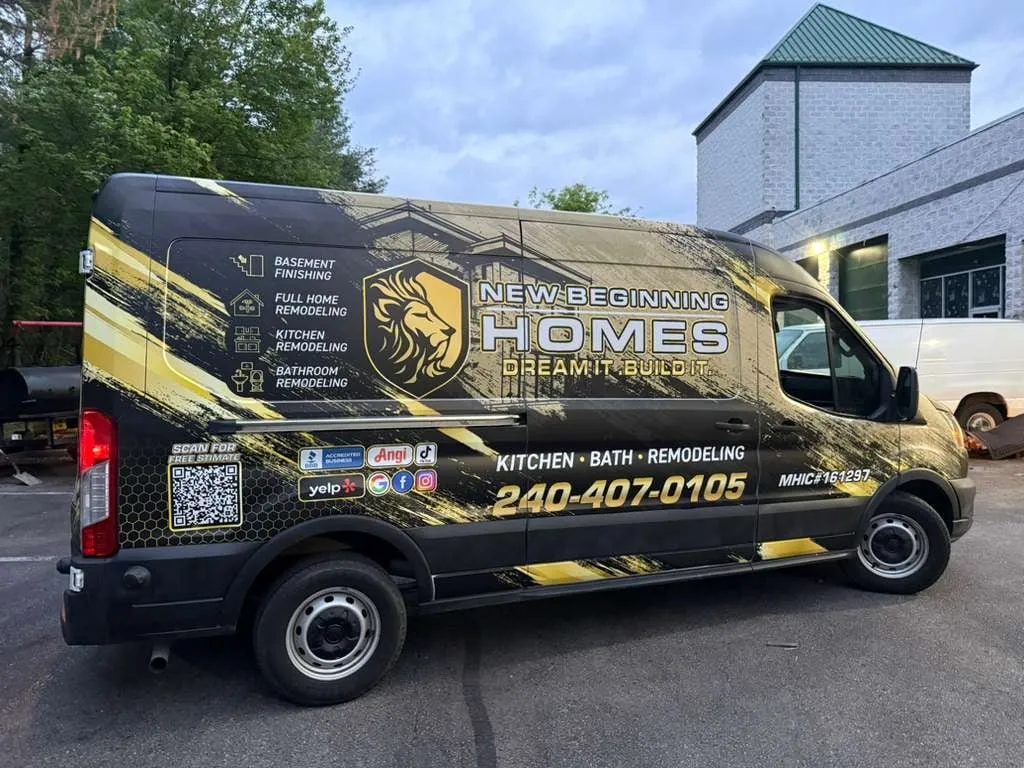 New Beginning Homes van, side view, black and gold wrap