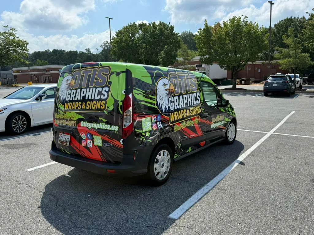 Otis Graphics' own service van, wrapped with the company's own branding