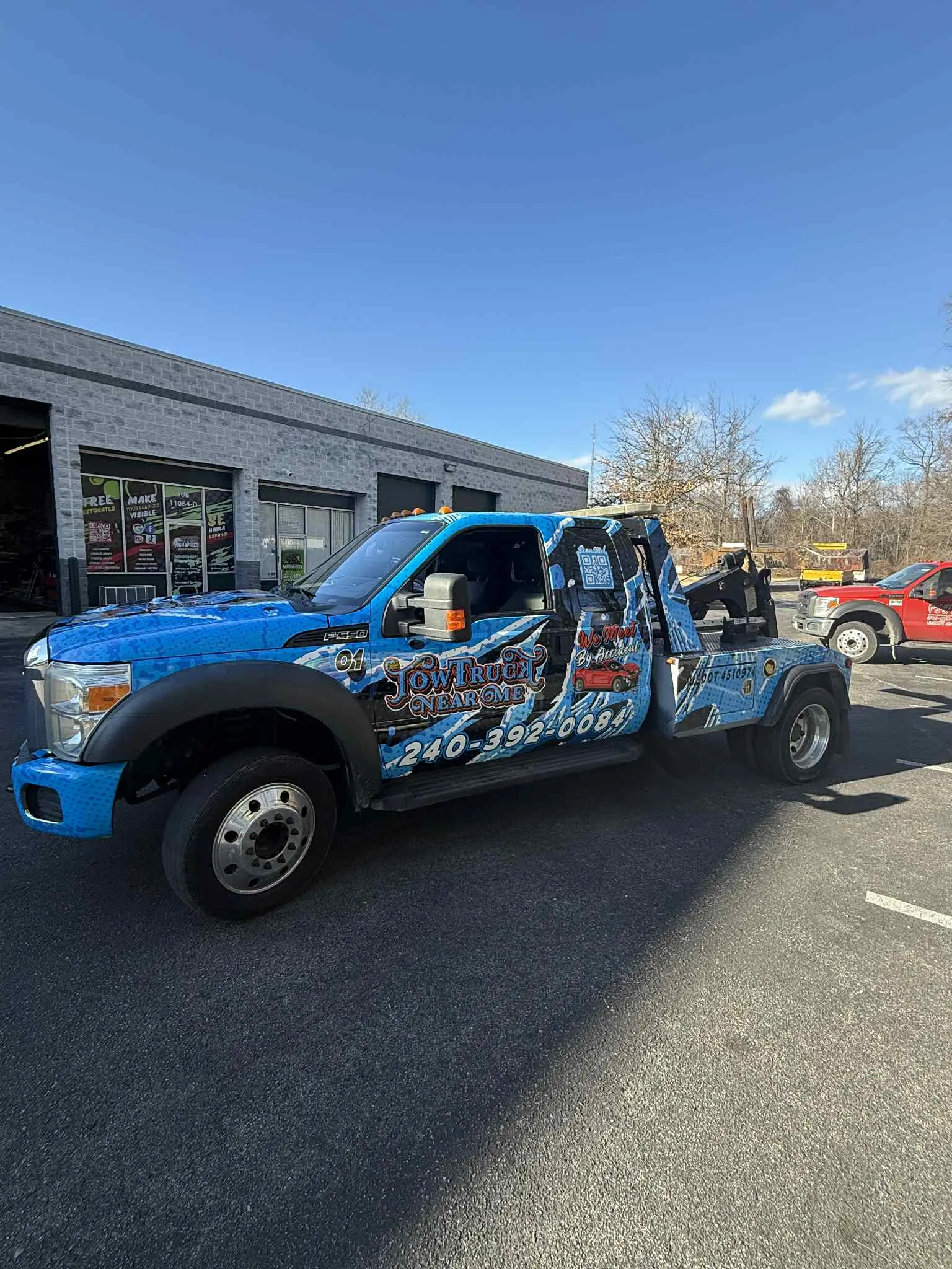 Green and black full vehicle wrap on a general contractor's service van
