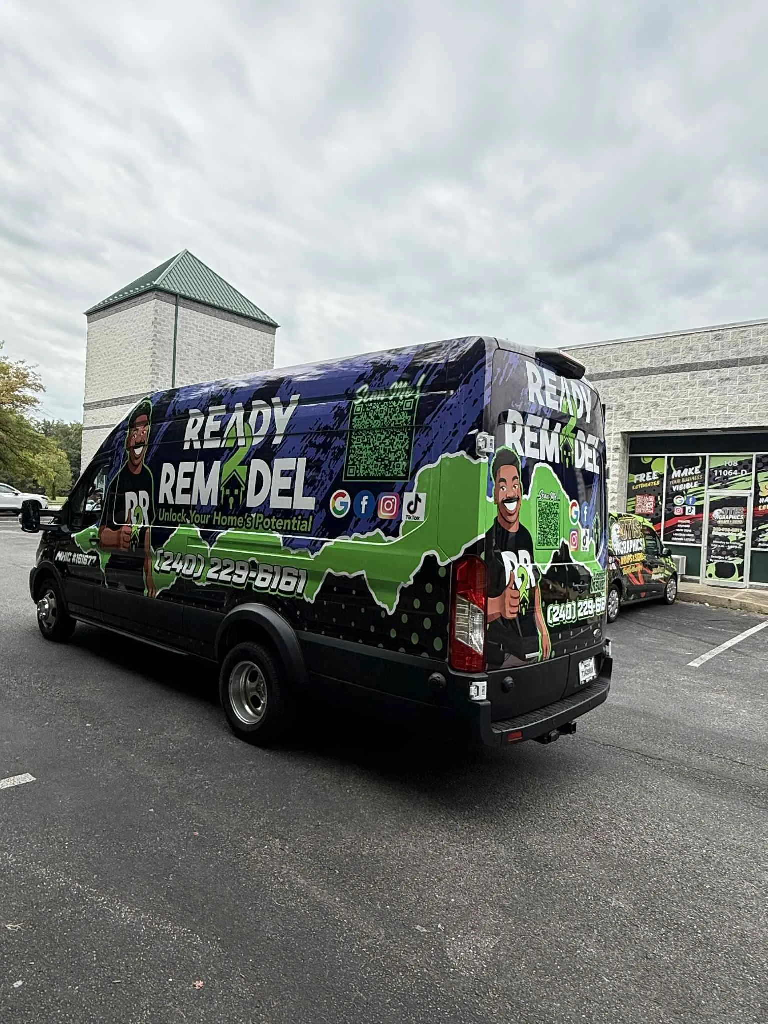 Ready 2 Remodel van, side view, purple and green wrap
