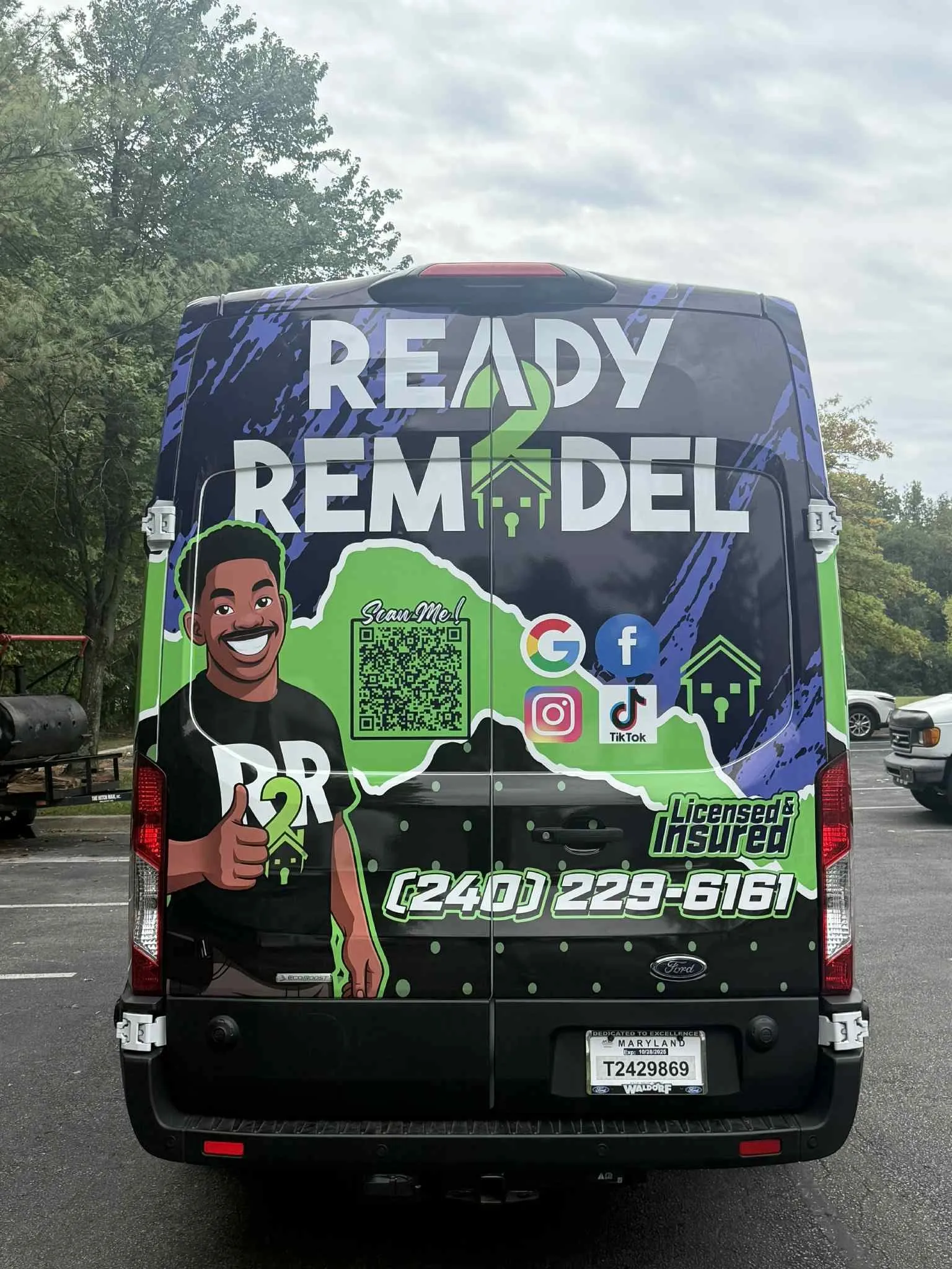 Ready 2 Remodel box van, rear close-up, purple and green wrap with mascot