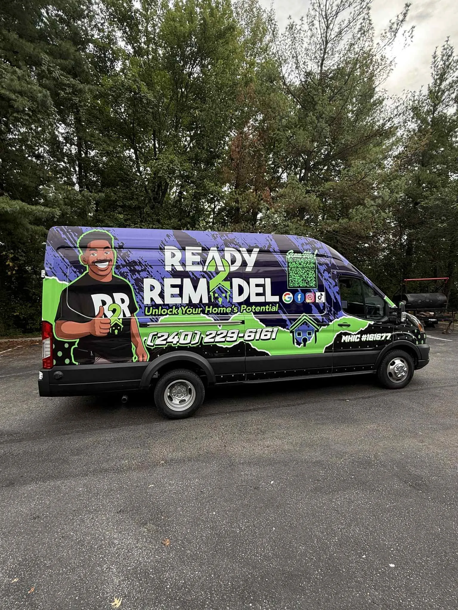 Ready 2 Remodel van, side view, purple and green wrap