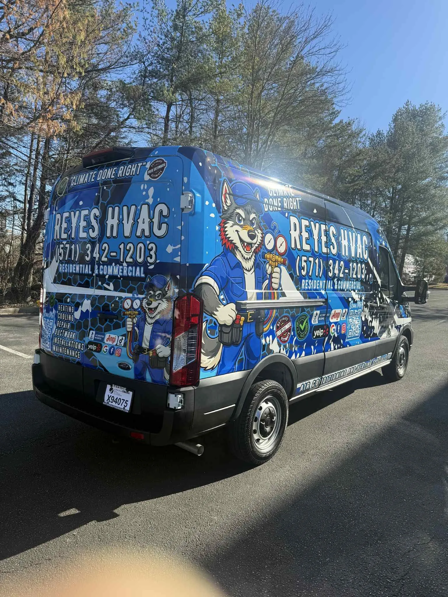 Reyes HVAC service van with husky mascot and blue wrap