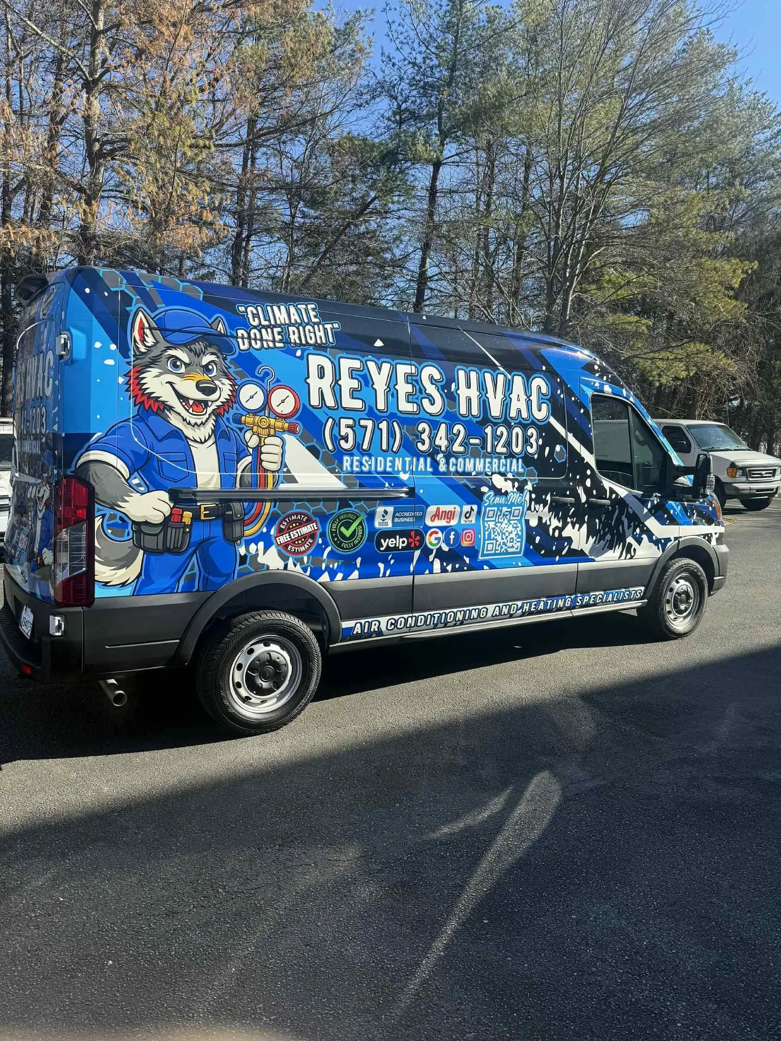 Reyes HVAC van, rear view, husky mascot, Climate Done Right