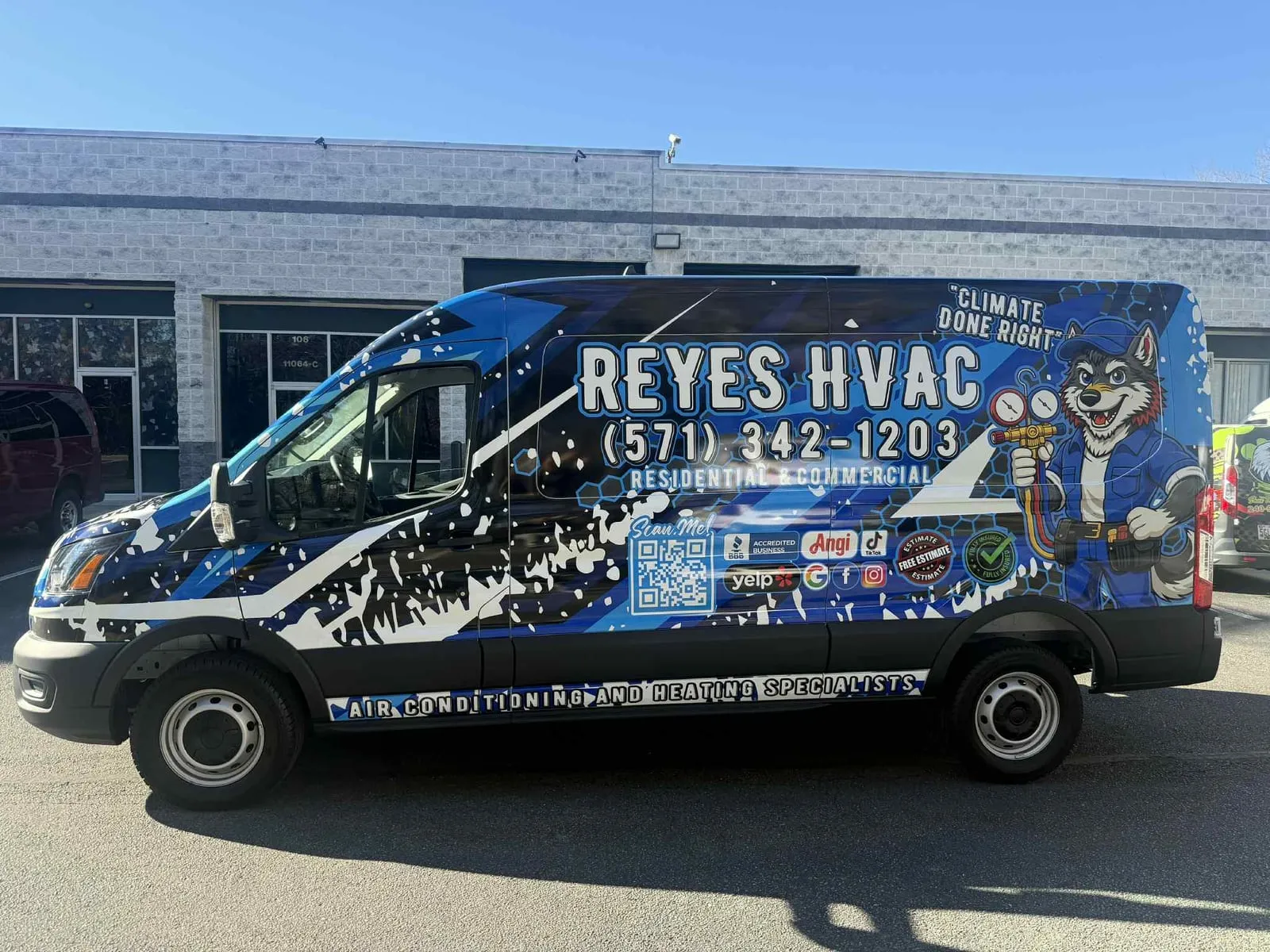 Reyes HVAC van, side view, husky mascot wrap
